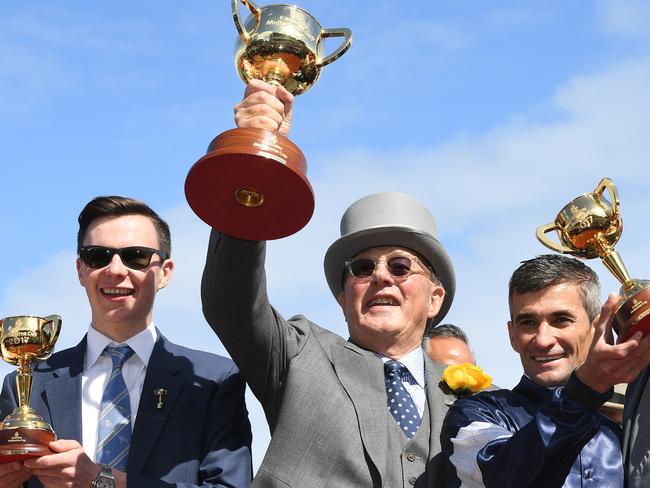 Lloyd Williams (centre) collects his sixth Melbourne Cup after Rekindling’s win last year.