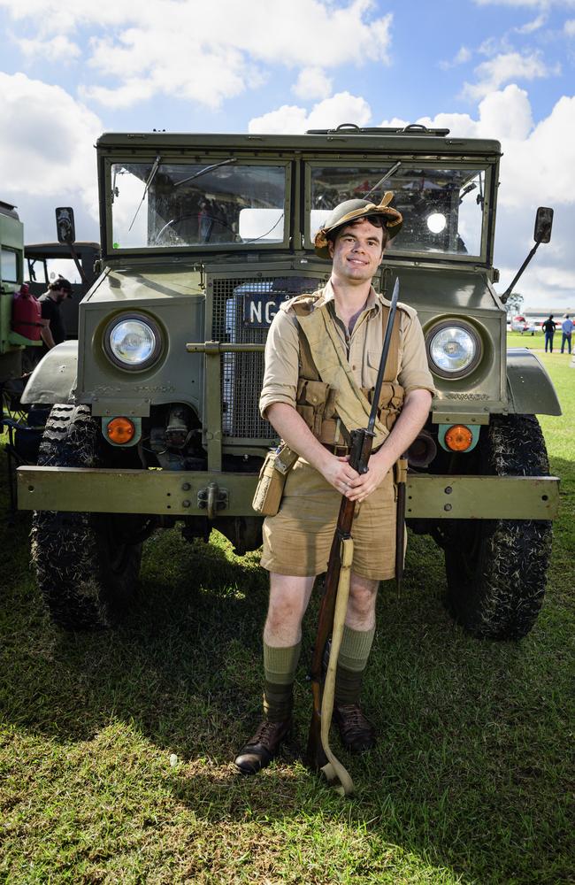 2nd/15th Australian Infantry Battalion reenactor group member Jacob Augostin stands with a 19434 Chevrolet Blitz on show at the David Hack Classic, Sunday, May 18, 2025. Picture: Kevin Farmer