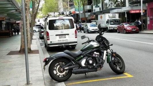 A parked motorcycle in Melbourne’s CBD.