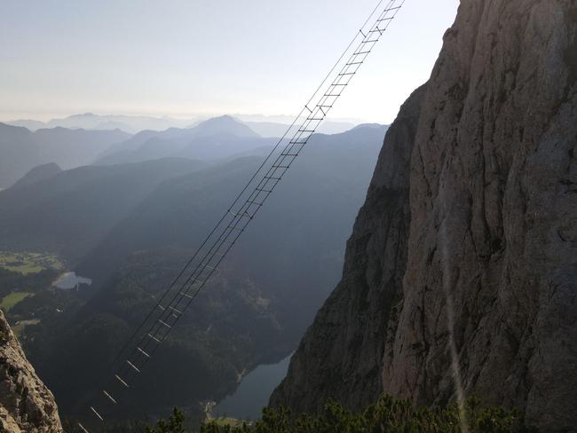 ONE TIME WEB USE FOR NEWS.COM.AU ONLY - FEES APPLY - MUST DOWNLOAD ON OWN ACCOUNT FOR REUSE - 2H8114N One of the most famous via ferratas in the world. The via ferrata on Donnerkogel in Austria. A ladder to the other side of the mountain . extremePicture: Alamy