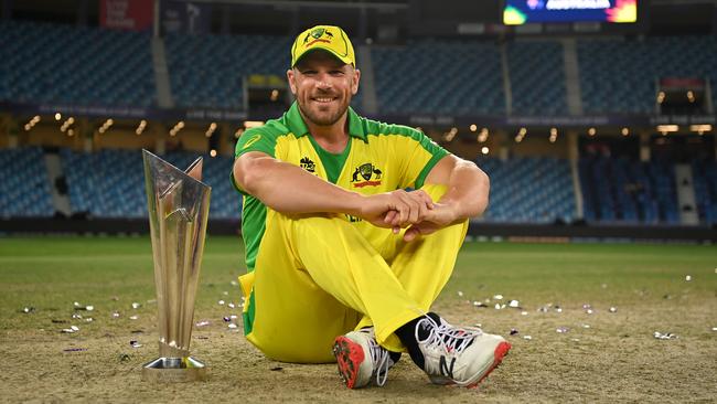 DUBAI, UNITED ARAB EMIRATES - NOVEMBER 14: Australia captain Aaron Finch poses with the ICC T20 World Cup after the ICC Men's T20 World Cup final match between New Zealand and Australia at Dubai International Cricket Stadium on November 14, 2021 in Dubai, United Arab Emirates. (Photo by Gareth Copley-ICC/ICC via Getty Images)