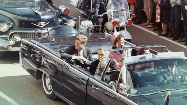 John and Jackie Kennedy smile at the crowds lining their motorcade route in Dallas, Texas, on November 22, 1963. Minutes later the president was assassinated as his car passed through Dealey Plaza. Picture: Getty Images