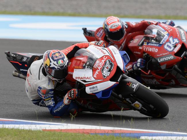 Australia’s Jack Miller (43) duels with Andrea Dovizioso. Miller carried the Kiwi silver fern on his race number as a tribute to the Christchurch shooting victims. Photo: AFP