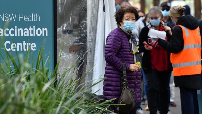 Members of the public queue outside at a mass COVID-19 vaccination hub in Sydney. Picture: NCA NewsWire/Joel Carrett