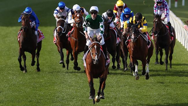 James McDonald high in the irons as Via Sistina crosses the winning line for her record breaking Cox Plate victory Picture: Kelly Defina