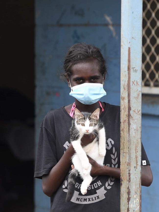 Rockhole resident brings her kitten outside after a hard lockdown in Rockhole. Picture: (A)manda Parkinson