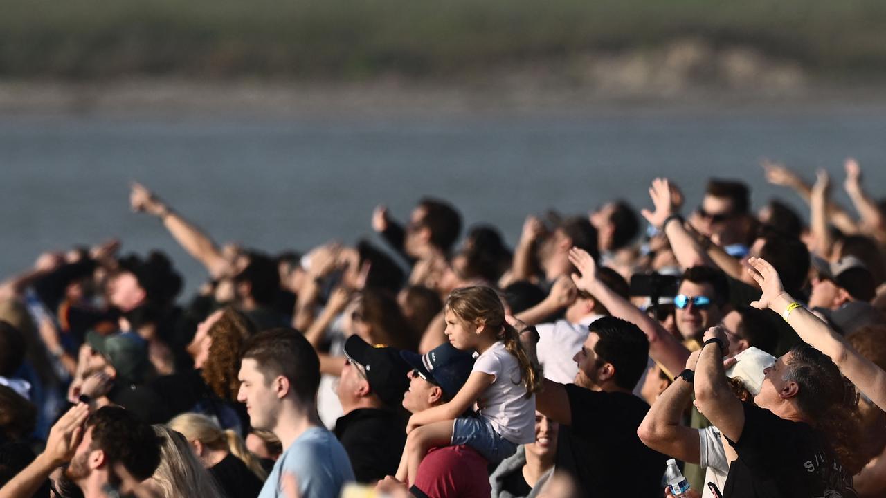 Spectators watch from South Padre Island, Texas, as the SpaceX Starship launches for a flight test. (Photo by Patrick T. FALLON / AFP)