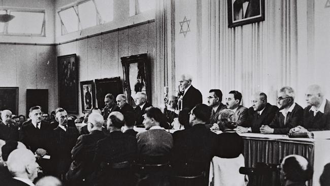 Israel's first Prime Minister David Ben Gurion reads the Declaration of Independence in the Tel Aviv Museum Hall, 1948.