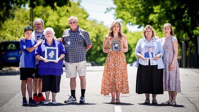 Chris McEwan, holding a picture of her daughter Sonia and family Edward, Greg and Roger stands beside Lauren Ralph, holding a picture of her sister Abigail and Wendy Curtis, holding a picture of her husband Brenton, with daughter Kimberly Gilmour. Picture: Mike Burton