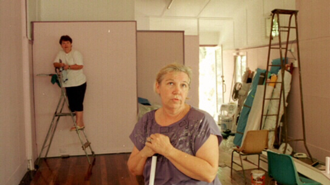 Charmaine Compagnoni and Zelda Carroll clean up before restocking their shop on February 18, 1999. Photo: Graeme Parkes