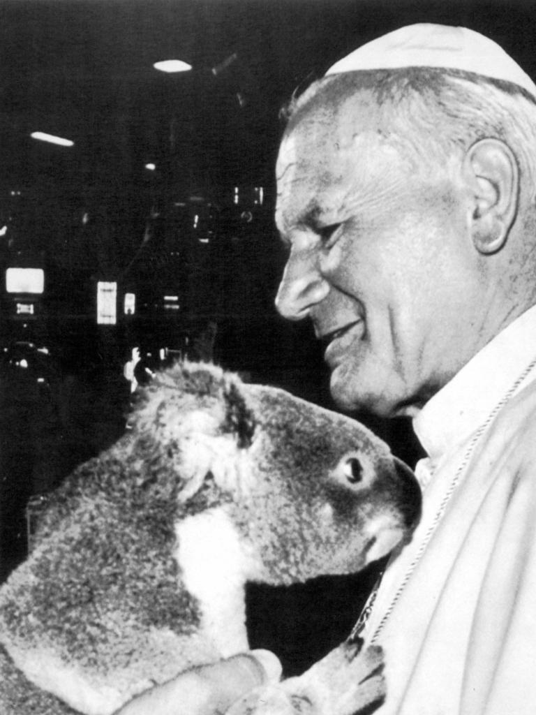 Catholic leader Pope John Paul II hugging koala during Australian Tour 25 Nov 1986.