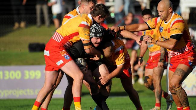 Sawtell’s Tyson Wicks held by the defence. Picture: Leigh Jensen