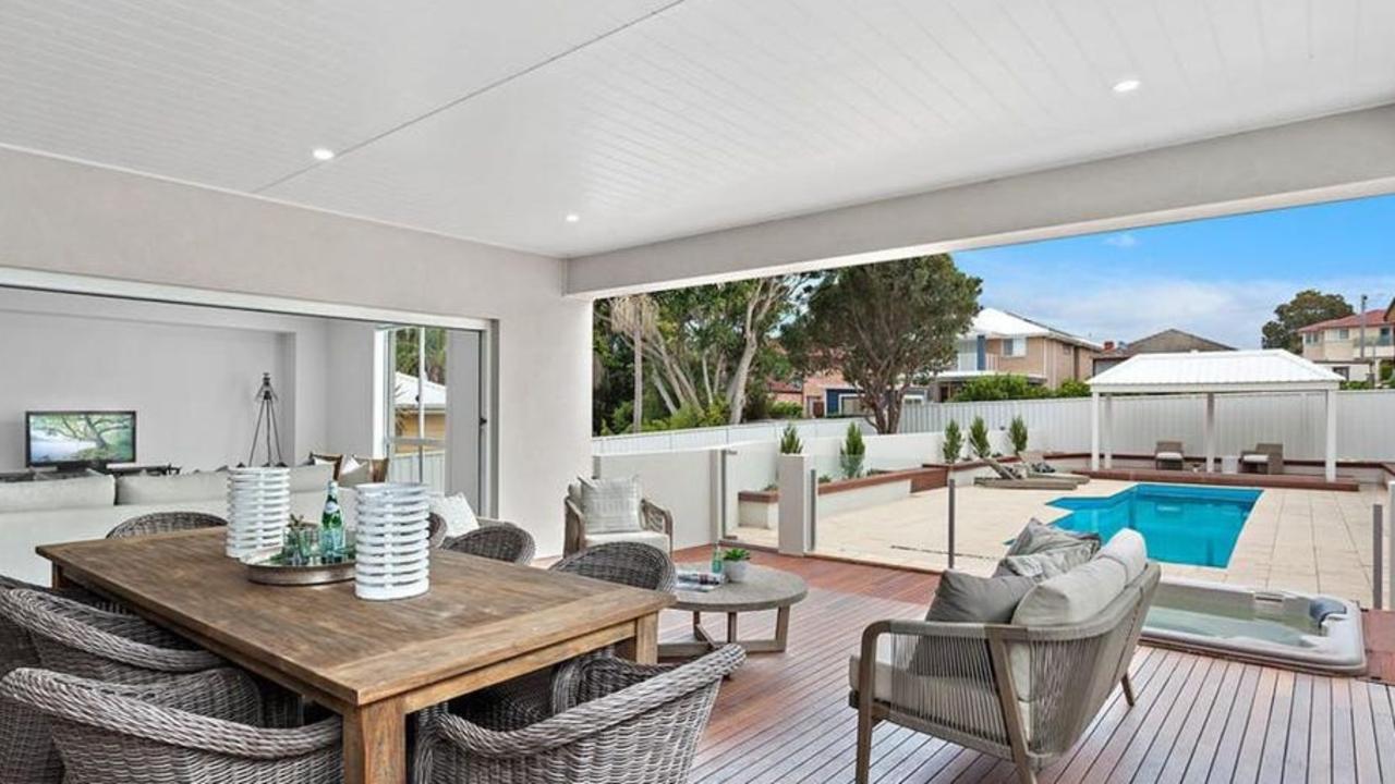 A cabana, pool and spa sit out back.