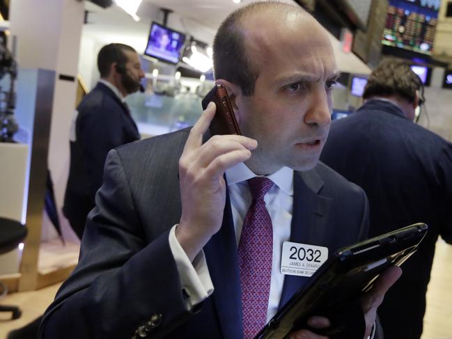 Trader James Denaro works on the floor of the New York Stock Exchange, Wednesday, March 30, 2016. Stocks are opening slightly higher on Wall Street, building on gains from the day before. (AP Photo/Richard Drew)