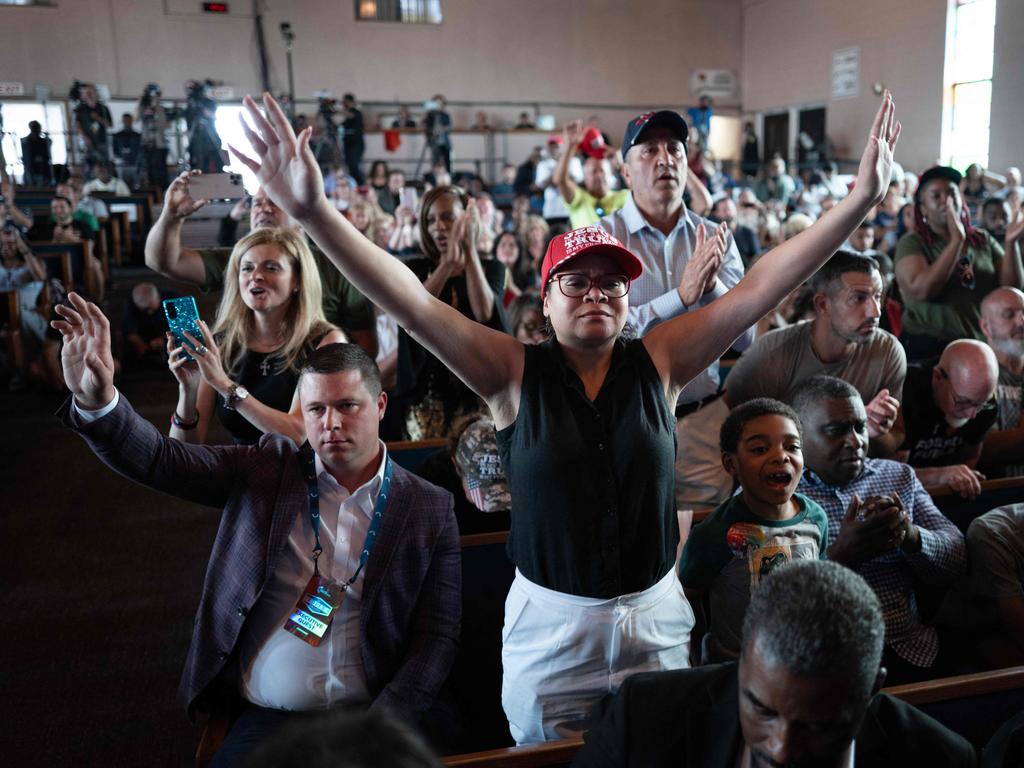 Guests pray at the close of a roundtable discussion at the 180 Church. Picture: Getty Images