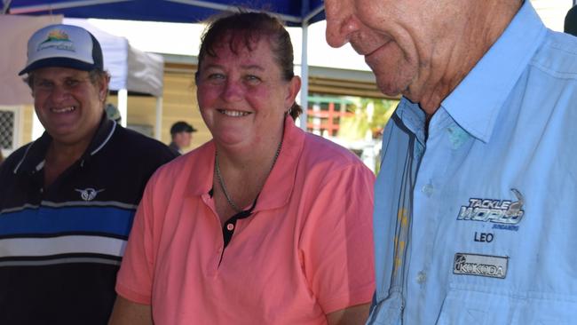 Tonya Ravenscroft (centre) with Biggenden Hospital Auxiliary members Leo Heaton and Tom Gething busy on the barbecue stall, 2017.