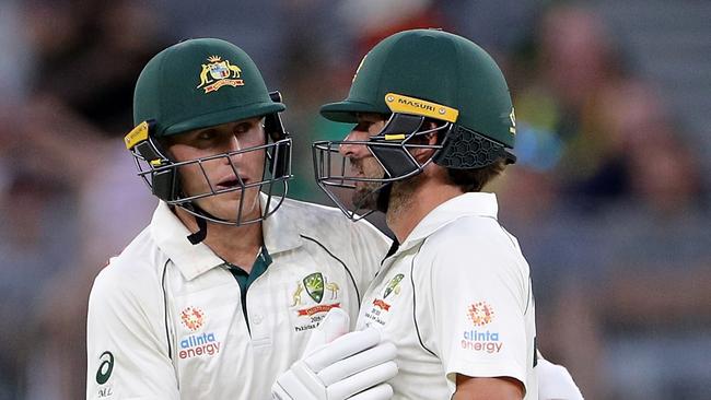 Marnus Labuschagne (left) and Joe Burns shared an 87-run partnership on day three.