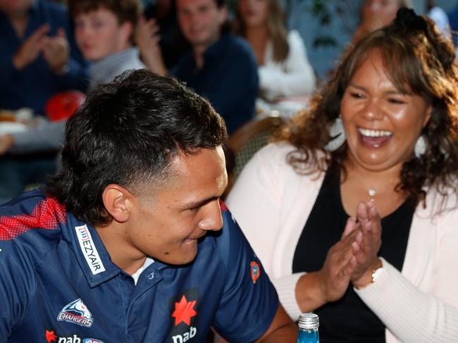 Jamarra Ugle-Hagan celebrates with family after being announced as the number one pick during the NAB AFL Draft in 2020. Picture: by Michael Willson/AFL Photos via Getty Images