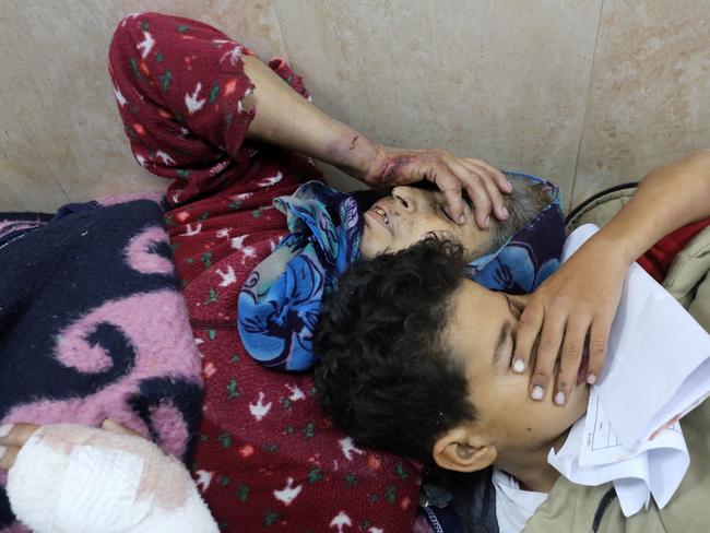 A woman and a child injured in an Israeli bombardment lie side-by-side at the emergency ward of the al-Aqsa hospital in Deir al-Balah in the central Gaza Strip. Picture: AFP