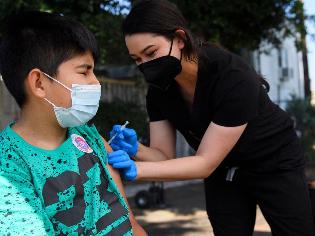 Jair Flores, 12, receives the COVID vaccine. Picture: AFP