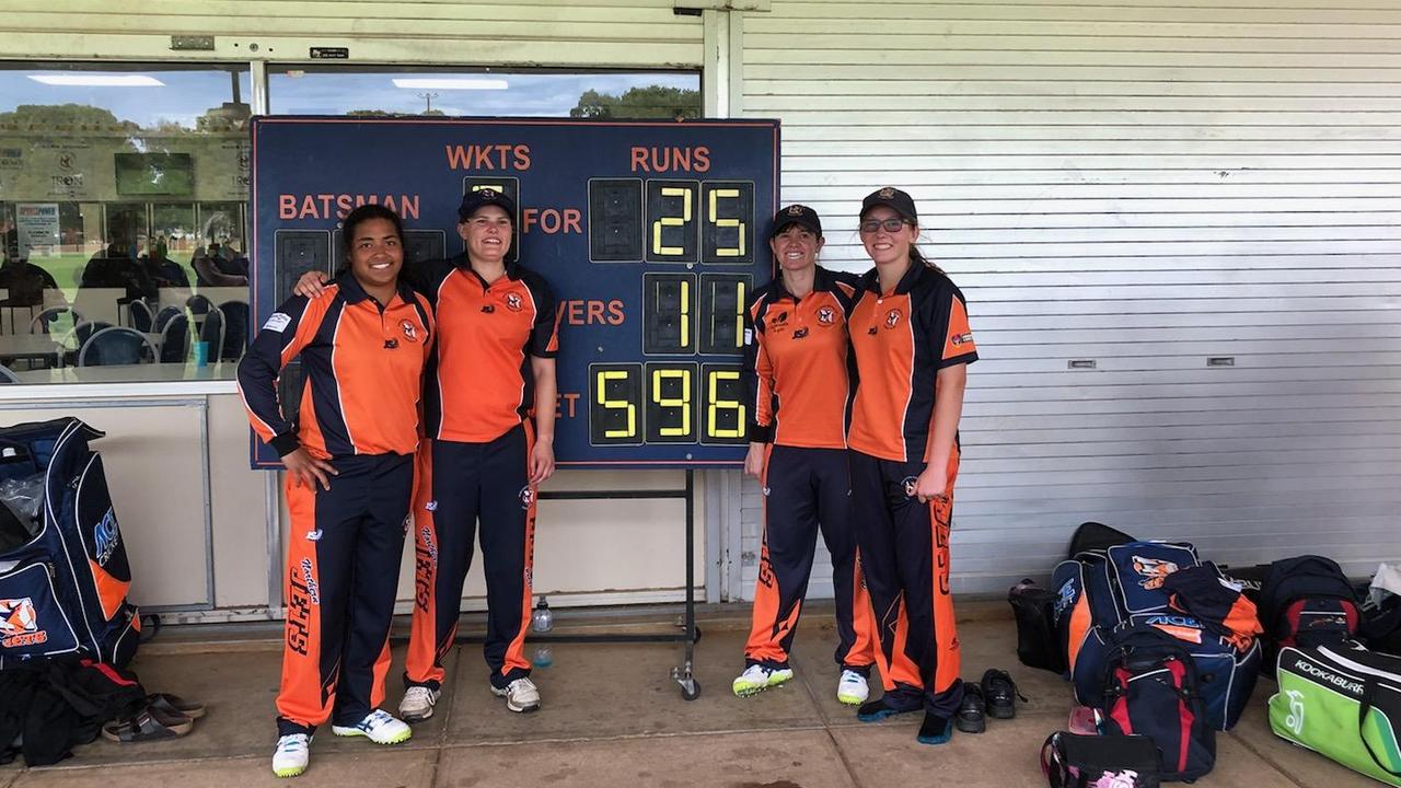 Northern Districts century-makers Tabitha Saville, Samantha Betts, Tegan McPharlin and Darcie Brown in front of Northern Districts' possible world record 50-over total. Picture: Supplied