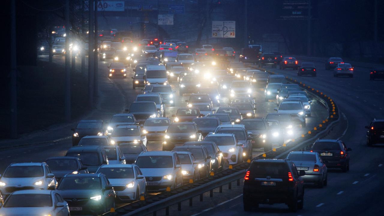 Cars drive towards the exit of the city after Russian President Vladimir Putin authorised a military operation. Picture: REUTERS/Valentyn Ogirenko