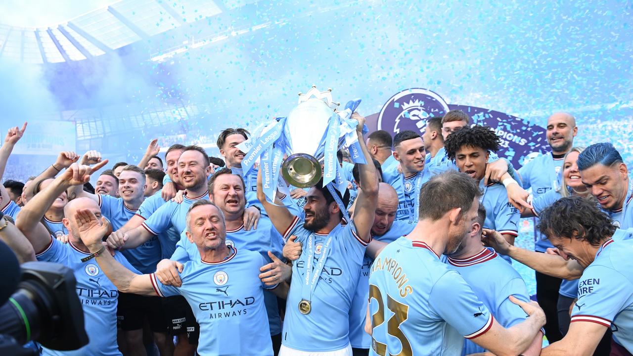 MANCHESTER, ENGLAND – MAY 21: Ilkay Guendogan of Manchester City lifts the Premier League trophy following the Premier League match between Manchester City and Chelsea FC at Etihad Stadium on May 21, 2023 in Manchester, England. (Photo by Michael Regan/Getty Images)