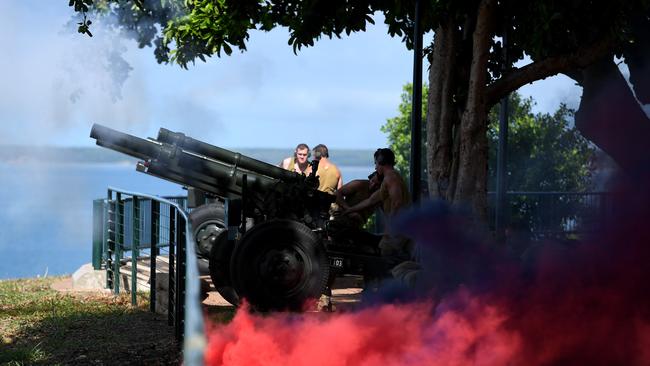 Smoke drifts across the Esplanade as soldiers fire cannons on the Darwin Esplanade to re-enact the Bombing of Darwin. Picture: Che Chorley