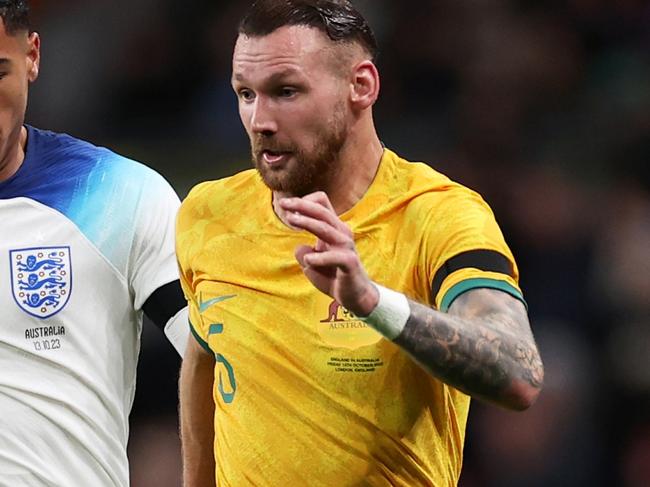 LONDON, ENGLAND - OCTOBER 13: Martin Boyle of Australia is challenged by Levi Colwill of England during the international friendly match between England and Australia at Wembley Stadium on October 13, 2023 in London, England. (Photo by Ryan Pierse/Getty Images)