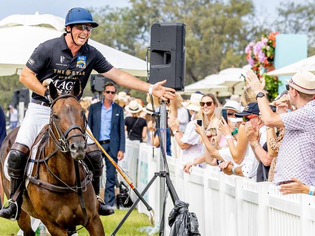 Polo pro Alec White plays up to the crowd. Picture: Luke Marsden.