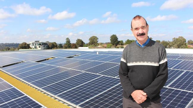 Banyule Mayor Wayne Phillips next to some of the council’s solar panels.