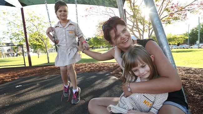 Rachel Bierling, 31, with daughters Helena, 7, and Olivia, 5, in a park in Nundah, Brisbane. The traditional Labor supporter voted Liberal. Picture: Lyndon Mechielsen