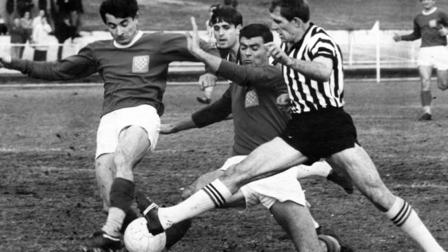 Steve Herczeg, right, is challenged by Croatia defenders Frank Balter and Peter Basic during a Socceroos match in 1968.