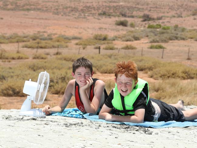 1.1.2019.Coverage on how outback towns cope in extreme heat. Jake Penhall,10, and William Franklin,11, at Blue Dam on the outskirts of Andamooka.  PIC TAIT SCHMAAL.