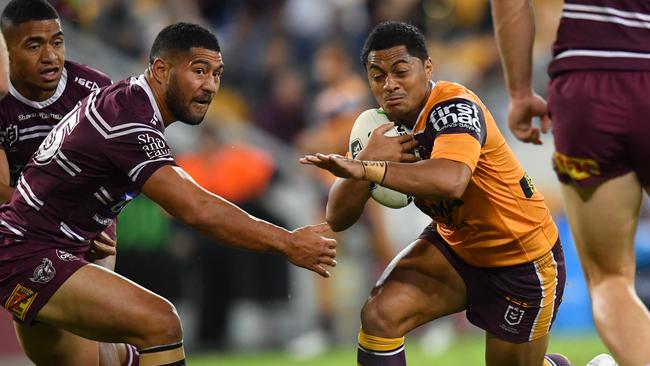 Anthony Milford breaks the Manly defensive line during the Magic Round clash at Suncorp Stadium.