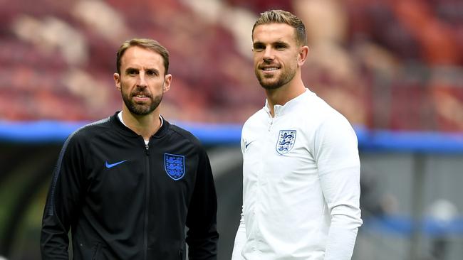 England midfielder Jordan Henderson (right) and coach Gareth Southgate inspect the Luzhniki Stadium pitch in Moscow. Photo: AFP