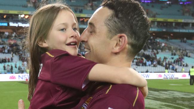 Billy Slater embraces daughter Tyla Rose following Queensland’s big win. Picture: Peter Wallis