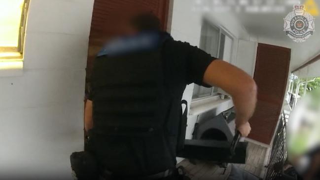 Major and Organised Crime Squad officers bust down the door of a Cairns North house during Operation Xray Gaston. Picture: Queensland Police