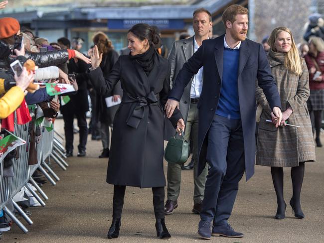 Britain’s Prince Harry and fiancée Meghan Markle greets well-wishers on arrival at Cardiff Castle in Cardiff, south Wales on January 18, 2018, for a day showcasing the rich culture and heritage of Wales. Picture: AFP