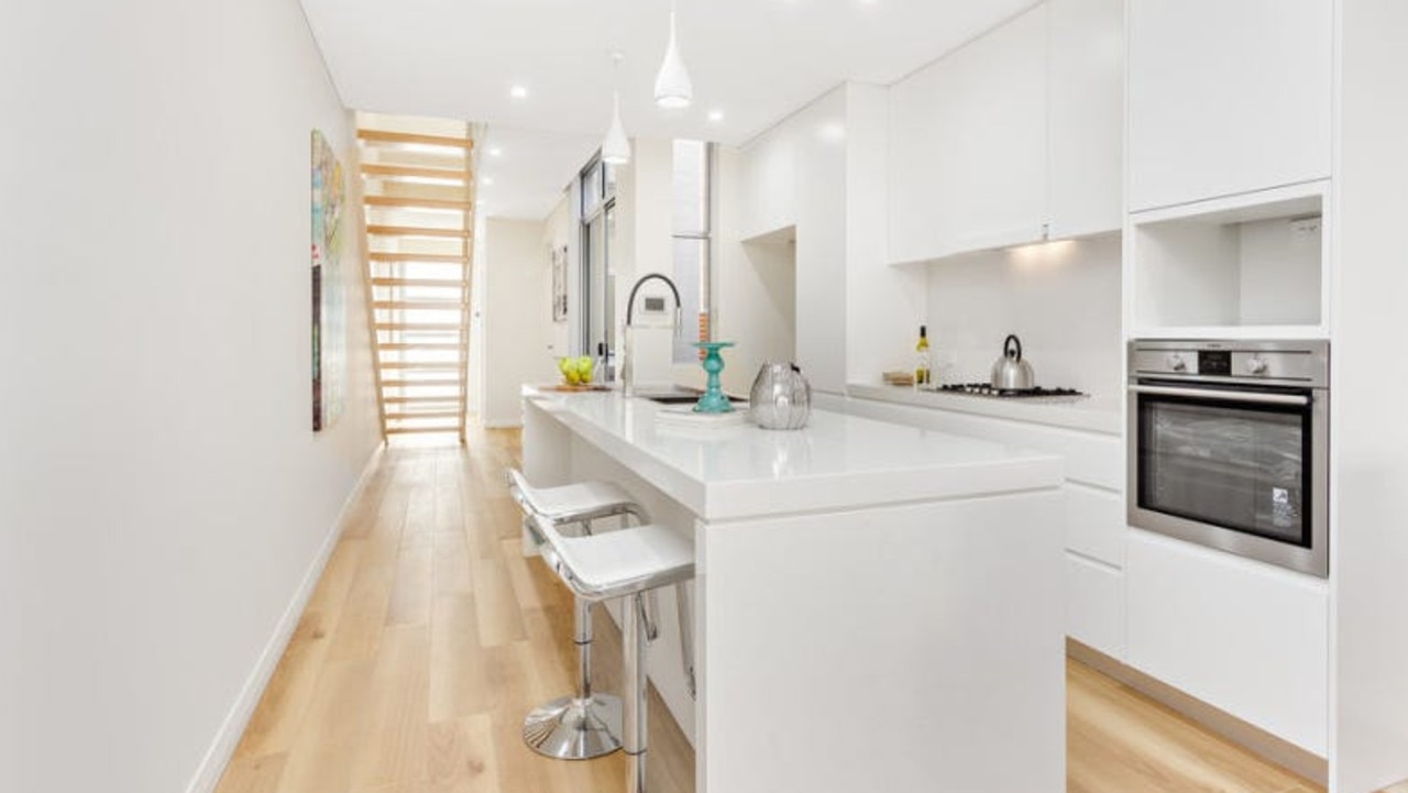 The home includes a modern kitchen and dining space, as pictured in 2015. Picture: Real Estate
