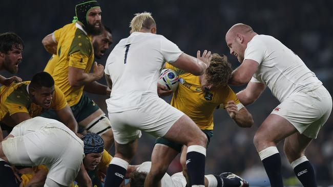 England's prop Joe Marler (C) and England's prop Dan Cole (R) vie against Australia's flanker Michael Hooper (2R) during a Pool A match of the 2015 Rugby World Cup between England and Australia at Twickenham stadium, south west London on October 3, 2015. Australia won the match 33-13. AFP PHOTO / ADRIAN DENNIS RESTRICTED TO EDITORIAL USE, NO USE IN LIVE MATCH TRACKING SERVICES, TO BE USED AS NON-SEQUENTIAL STILLS