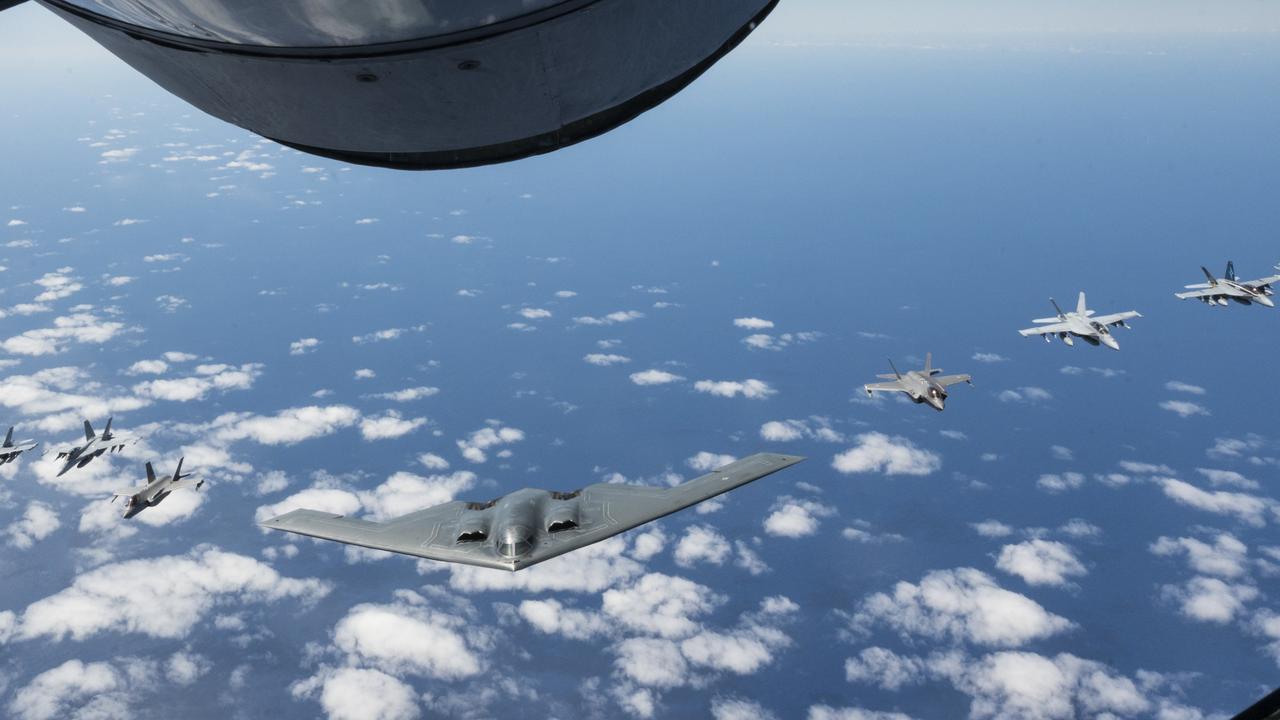 A US Air Force B-2 Spirit flying in formation with two Royal Australian Air Force F-35A Lightning IIs, two RAAF F/A-18F Super Hornets, two RAAF EA-18 Growlers, and two U.S. Air Force F-16C Aggressors in March 2022. Picture: USAF Sgt Hailey Haux