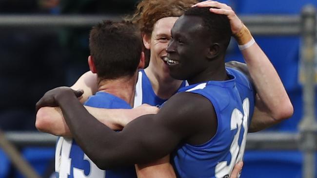 Mr Majak: Daw’s towering mark against Melbourne had teammates Declan Mountford and Ben Brown jumping for joy. Picture: AAP