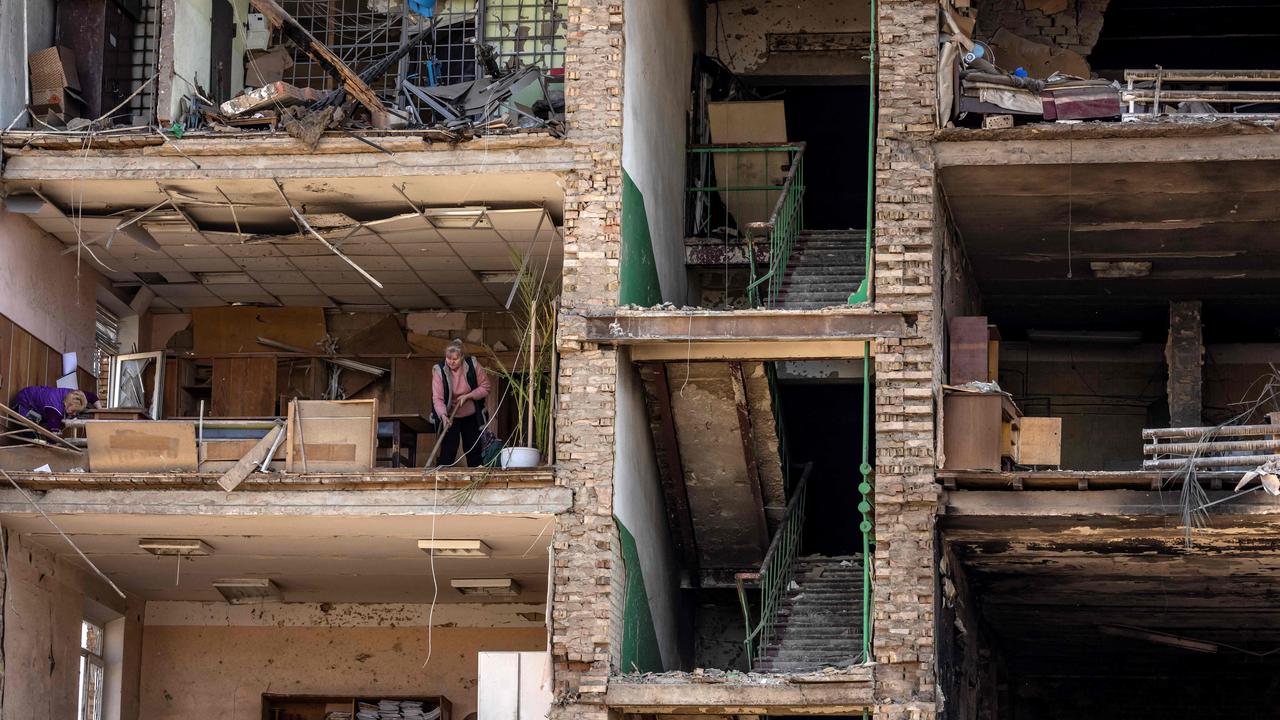 Women clean in the Ukrainian military factory outside Kyiv that produced missiles allegedly used to hit Russia's Moskva warship. Picture: FADEL SENNA / AFP)