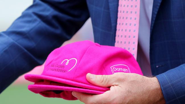 Glenn McGrath hands out the baggy pinks. Picture: Jeremy Ng/AFP