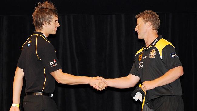 Damien Hardwick shaking Dustin Martin’s hand on draft night in 2008. Picture: George Salpigtidis