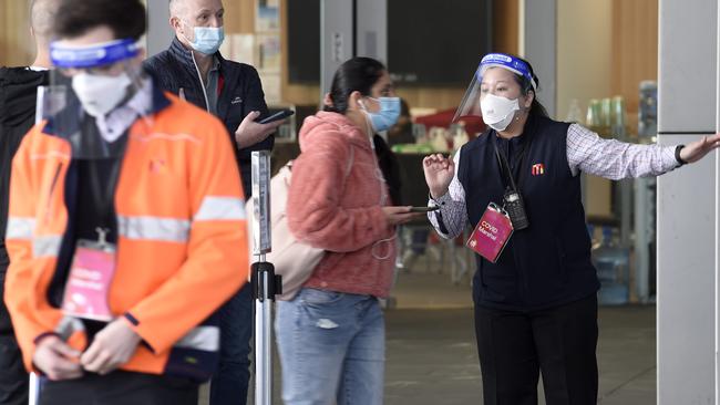 Victorians wait at the vaccination centre at the Melbourne Convention and Exhibition Centre. Picture: NCA NewsWire / Andrew Henshaw