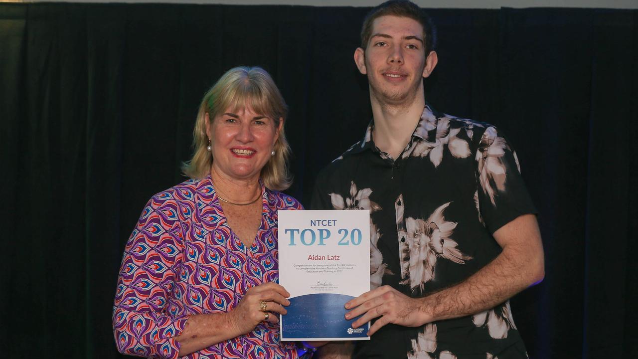 Education Minister Eva Lawler presents Darwin High's Aidan Latz his award after the announcement of 2022 NTCET Top 20 Year 12 Students and 2022 Top Aboriginal Student at NT Parliament House. Picture: Glenn Campbell