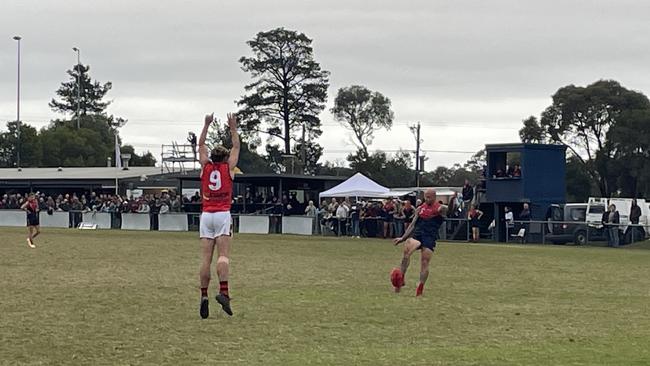 Nathan Jones kicks a goal in the first quarter on Saturday.