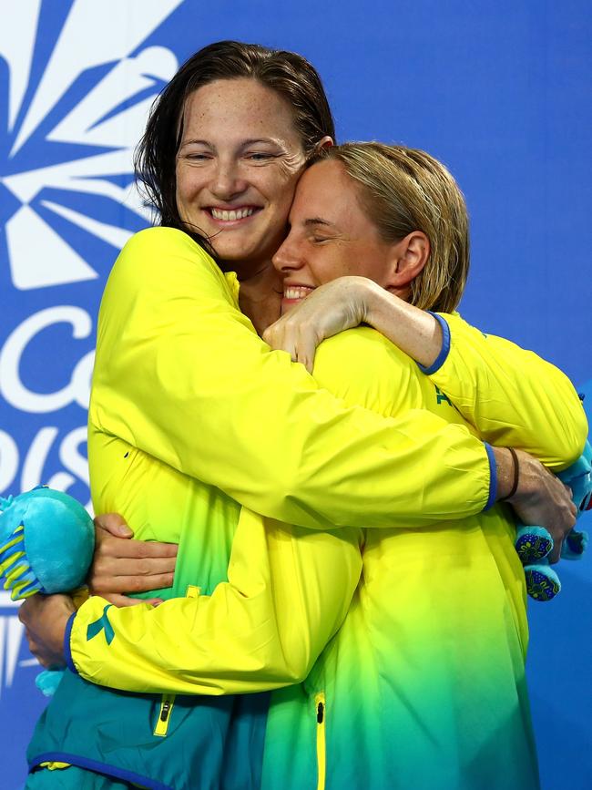 Silver medallist Cate Campbell (left) hugs her gold medal-winning sister Bronte after the medal presentation for the women’s 100m freestyle. Photo: Getty Images